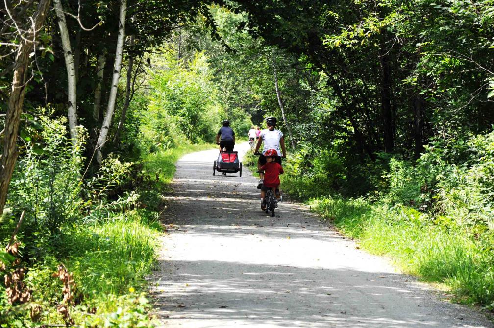 Family doing a cycling hike, on Axe Massawippi: