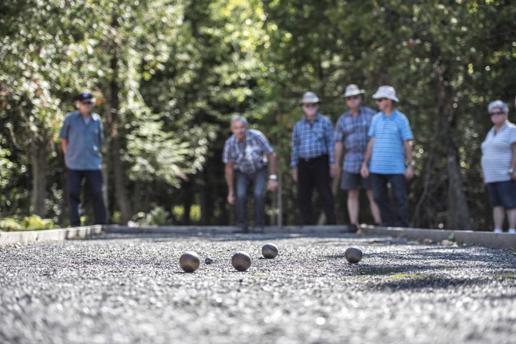  Playground for all: Game of petanque, iron available