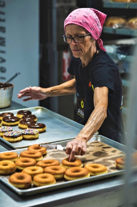 Donut Chef at Work - Johane: Legendary Johane begins her shift at midnight, hand making an average of 1,000 donuts per day. She prepares the dough, cuts, bakes, glazes, stuffs and sugars each donut by hand - all of our glazes and fillings are also homemade, from scratch!
